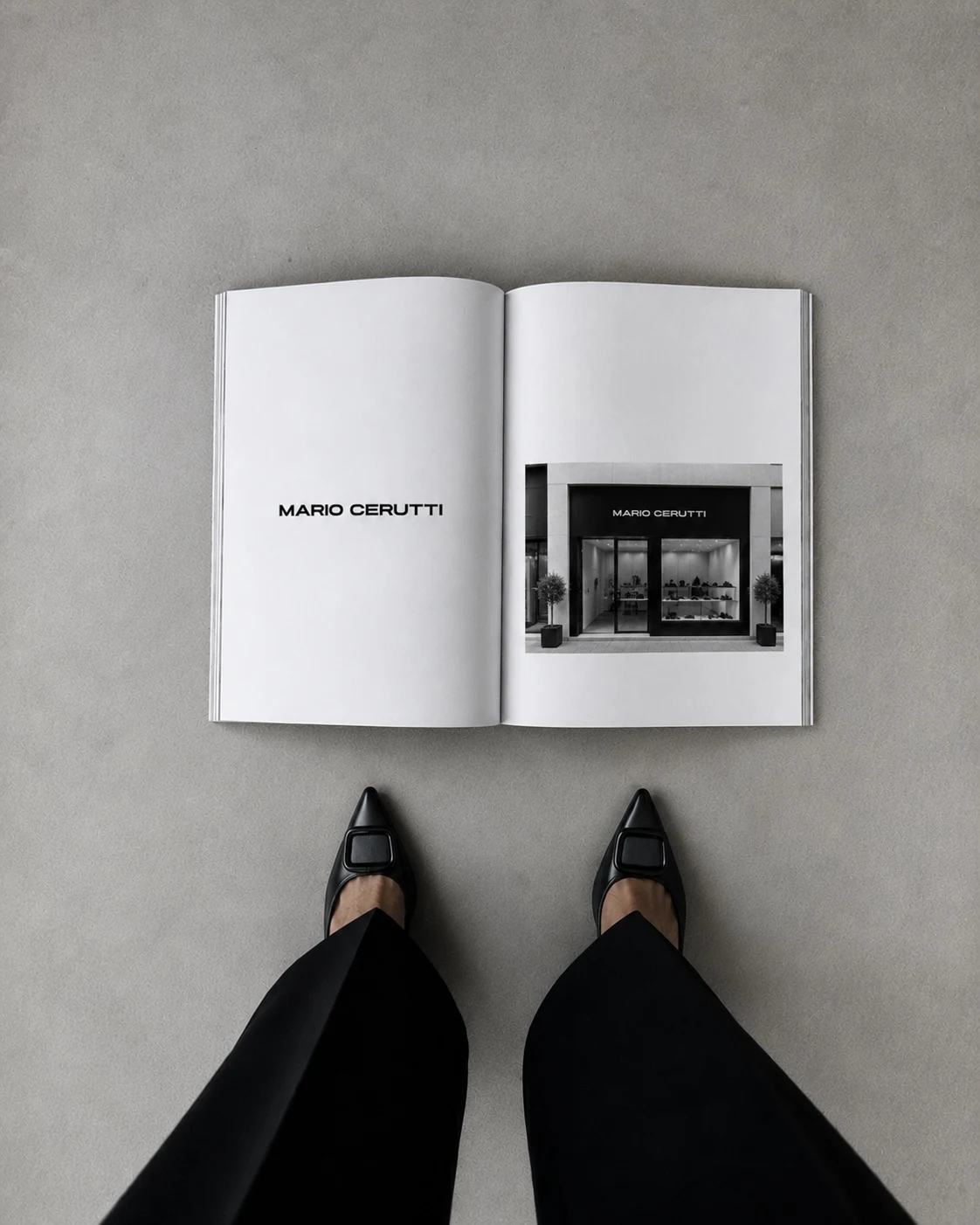 An open magazine showing the Mario Cerutti wordmark and boutique storefront, seen from above